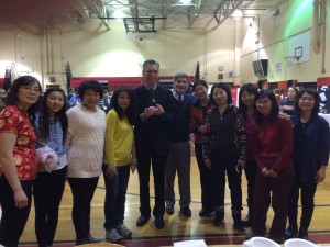 Syosset School District Superintendent, Dr. Rogers and HBT Principal, Mr. Kassebaum pose with Chinese parents at Multicultural Expo 2015